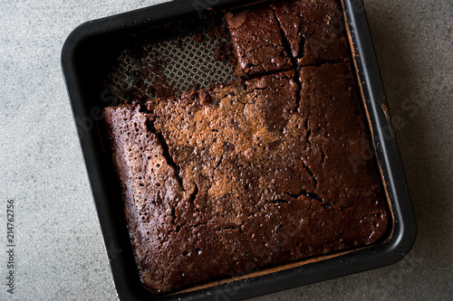 Square Juicy Chocolate Sponge Wet Cake with Sauce in Mold.