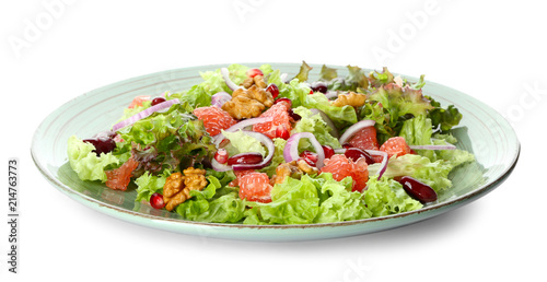 Plate with delicious fresh salad on white background