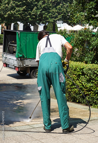 Street cleaner works with a steam clener photo