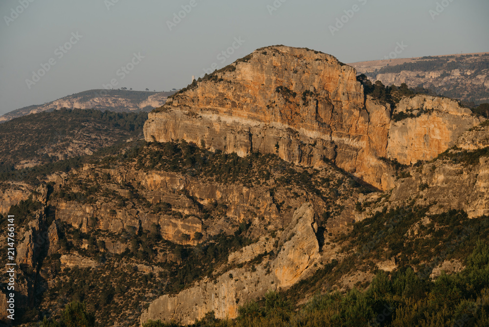 Huge cliff between other mountains in Spain on the sunset