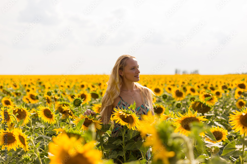 Model in sunflower field Model in sunflower field