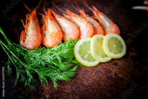 shrimps for dinner on stone plate. Food background