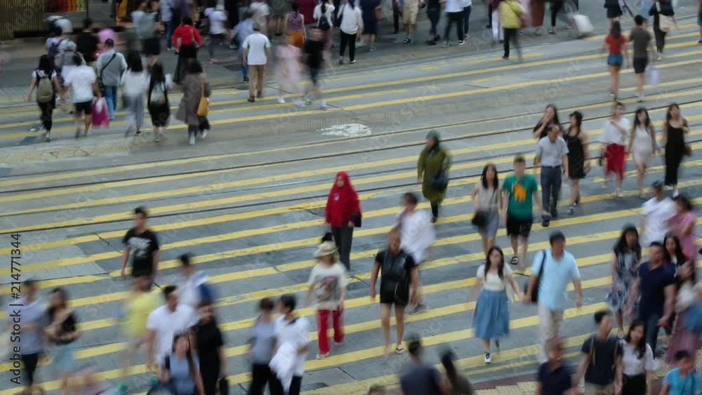 Crowd of people walking crossing street at a busy intersection in Hong Kong, Crowd of people walking crossing street at a busy intersection in Hong Kong,