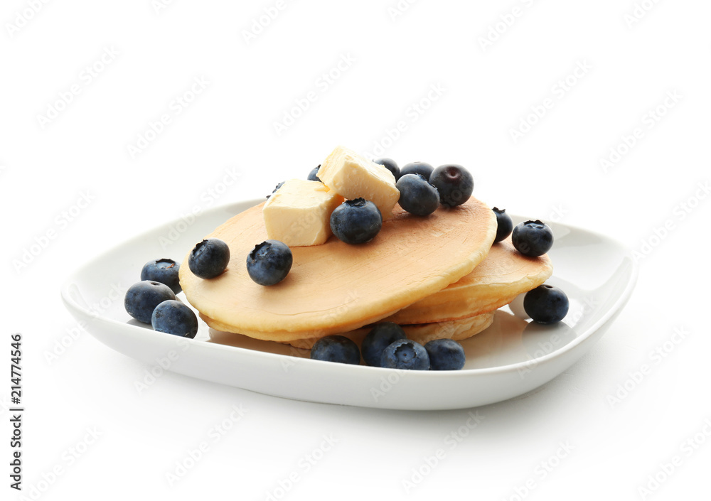 Plate with delicious pancakes and berries on white background Plate with delicious pancakes and berries on white background