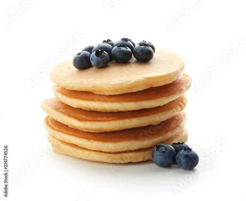 Delicious pancakes with berries on white background