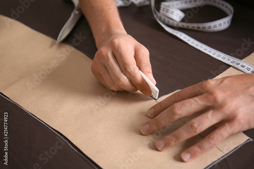 Young tailor working with s...