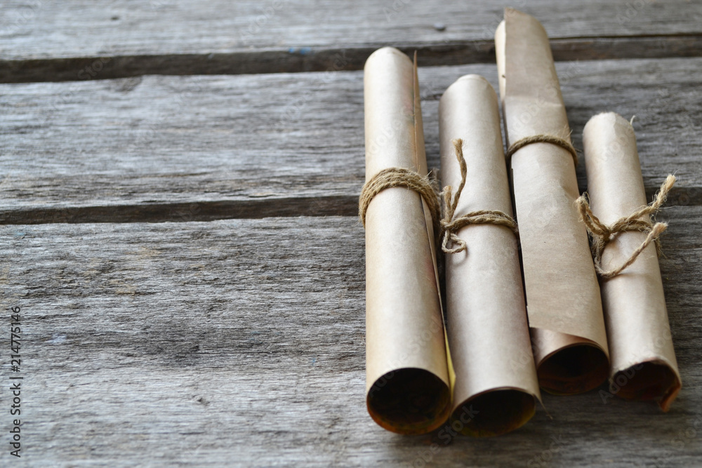 Fototapeta premium Rolls of paper tied with a rope. Free space for text .
