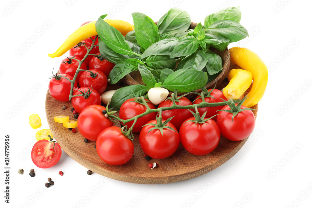 Plate with ripe cherry tomatoes, pepper, spices and herbs on white background Plate with ripe cherry tomatoes, pepper, spices and herbs on white background