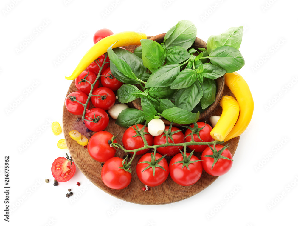 Plate with ripe cherry tomatoes, pepper, spices and herbs on white background Plate with ripe cherry tomatoes, pepper, spices and herbs on white background