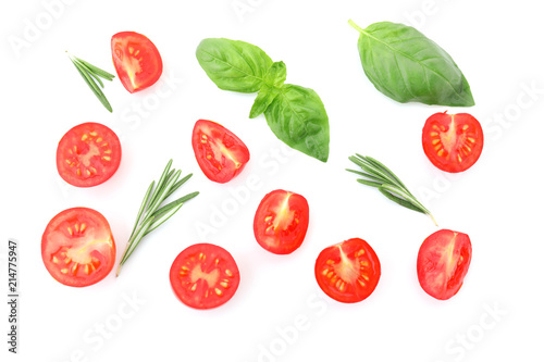 Ripe cherry tomatoes and herbs on white background