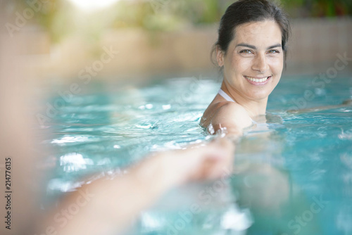 Brunette woman in spa pool