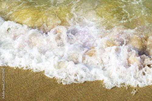 Sea foam on golden sand, texture, background, top view, no people