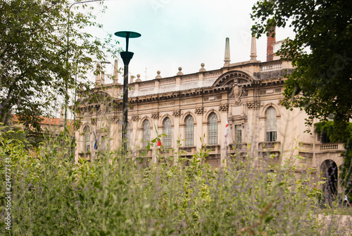 Building of the Polytechnic University of Milan with flora of the square