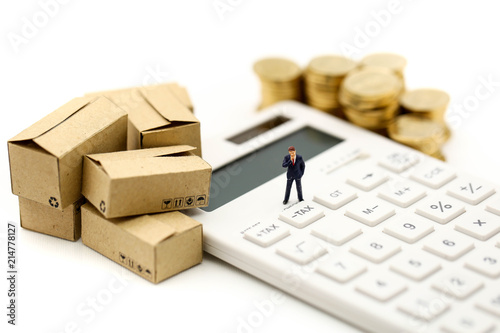 Miniature people : Businessman and box with coins and Calculator of tax,shipping, rent container, business concept.