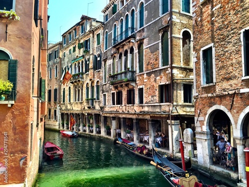 Gondolas and old architecture buildings in Venice, Italy