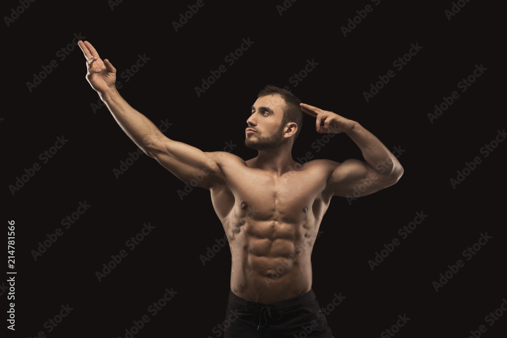 Strong athletic man showes naked muscular body Strong athletic man showes naked muscular body