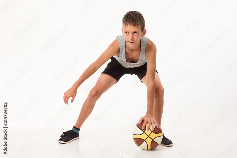 teenager with a basketball on a white background. teenager with a basketball on a white background.