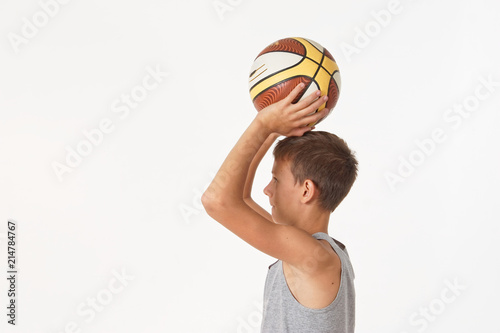teenager with a basketball on a white background.
