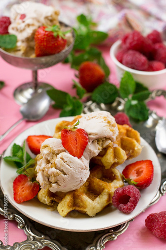 Belgian Liege waffles with strawberry ice cream and fresh berries