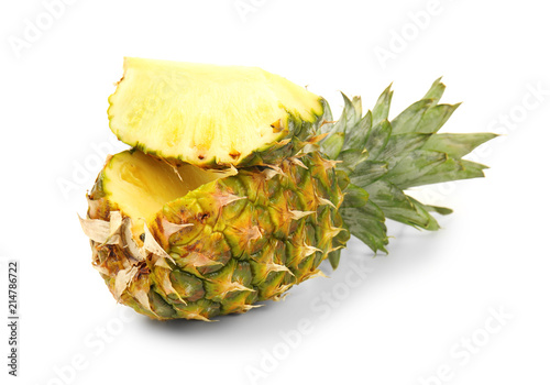 Cut ripe pineapple on white background photo