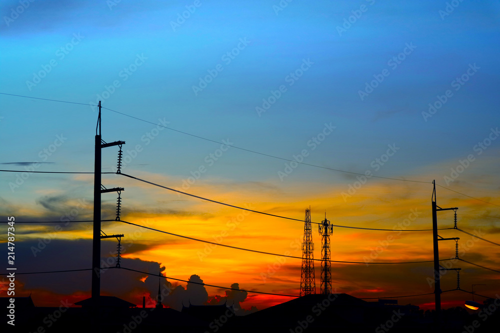 silhouette of power electric line pillar and colorful sunset