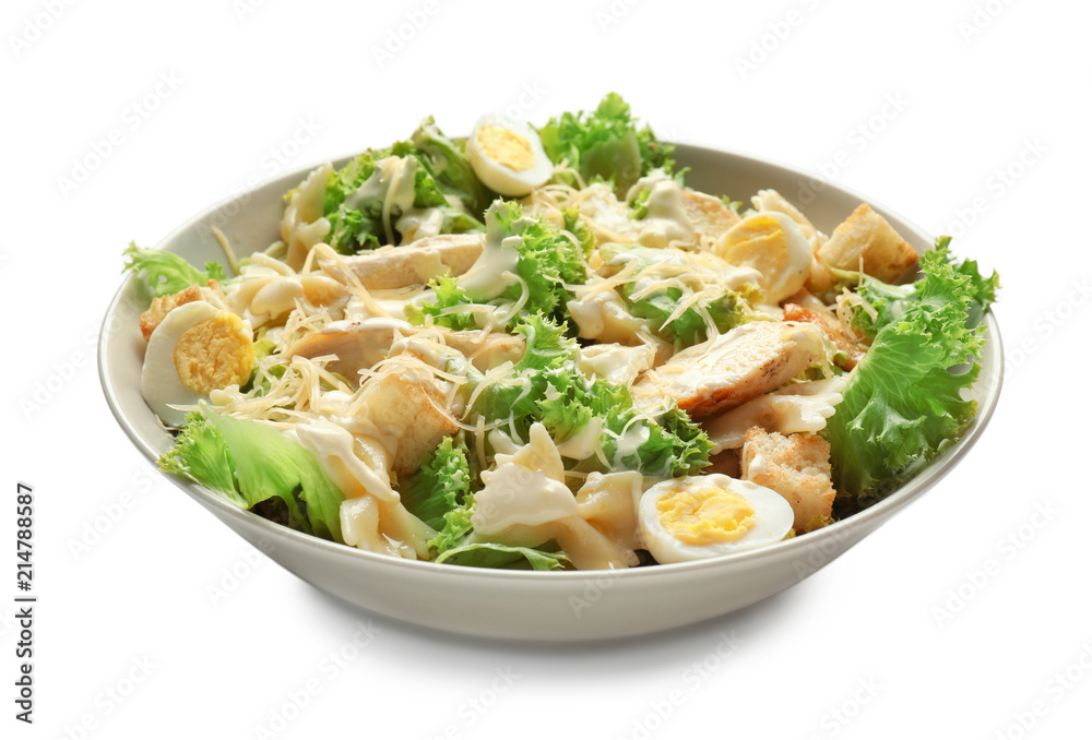 Tasty Caesar salad with pasta in bowl on white background Tasty Caesar salad with pasta in bowl on white background