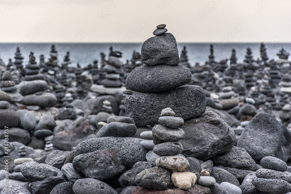 Volcanic rocks placed in pyramid mode, for enjoyment and relaxation. This unique place is located in the port of La Cruz in Tenerife (Spain) Volcanic rocks placed in pyramid mode, for enjoyment and relaxation. This unique place is located in the port of La Cruz in Tenerife (Spain)