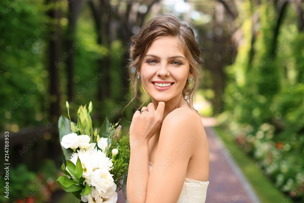 Beautiful young bride with wedding bouquet outdoors Beautiful young bride with wedding bouquet outdoors