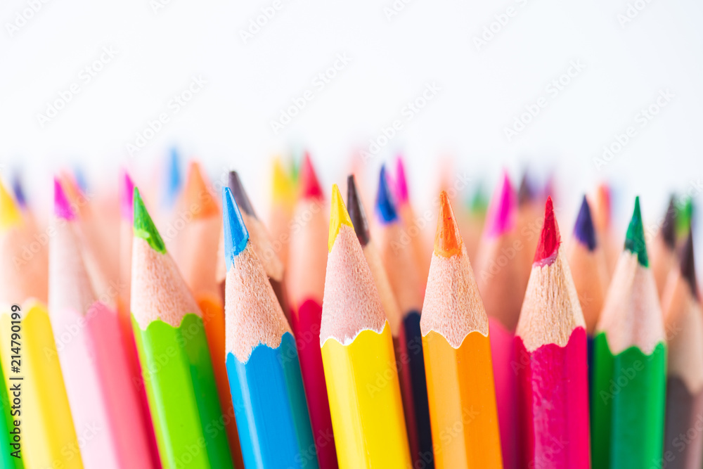 Education or back to school Concept. Close up macro shot of color pencil pile pencil nibs on white background. Education or back to school Concept. Close up macro shot of color pencil pile pencil nibs on white background.