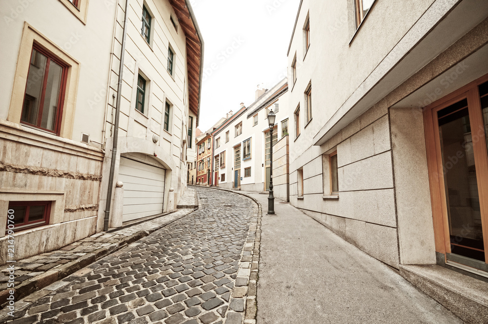 Empty narrow cobblestone street in old town