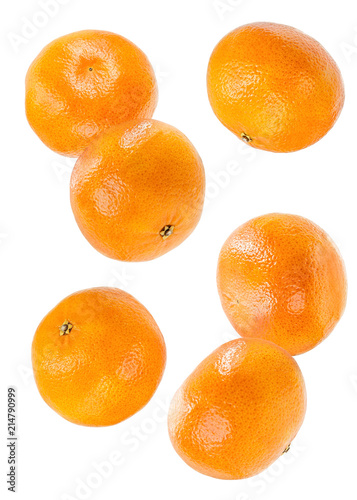 whole tangerines flying in the air isolated on white