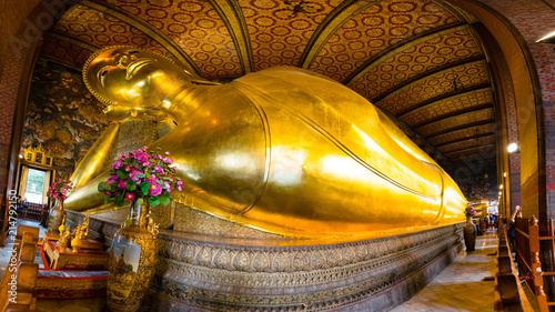 Reclining Buddha monumental figure in Phra Buddhasaiyas temple, Bangkok, Thailand. photo