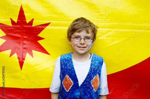 Little kid boy in eye glasses in magician costume. Happy child making circus as school project