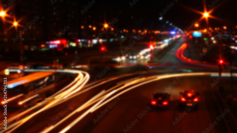 blurred traffic light trails on road at night in Russia