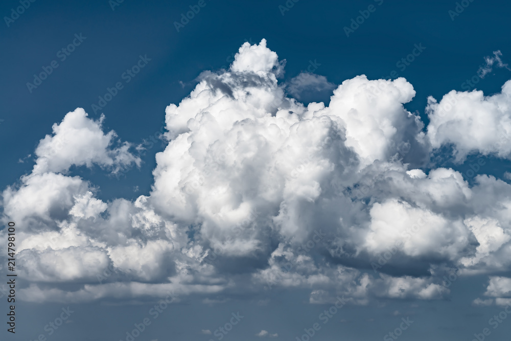 massive dramatic cumulus cloud in the blue sky massive dramatic cumulus cloud in the blue sky