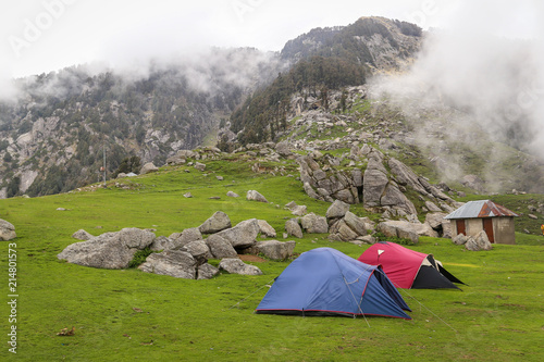 A group of dome tents placed on a grass field near Mcleodganj  Snow Line  Himachal Pradesh  India.