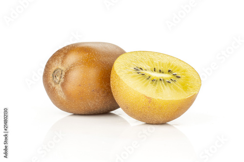 Group of one whole one half of fresh golden brown kiwi fruit sungold variety hairless isolated on white