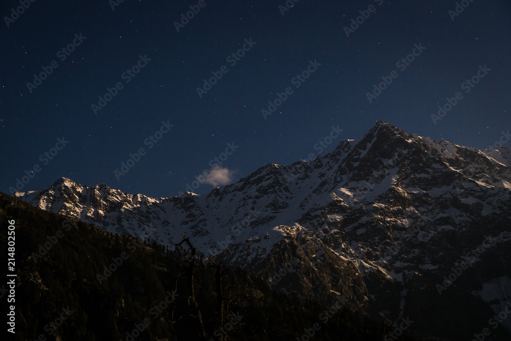 Amazing night view of mountains in snow at hill top, Snow Line, Mcleod ganj, Dharamsala, India.