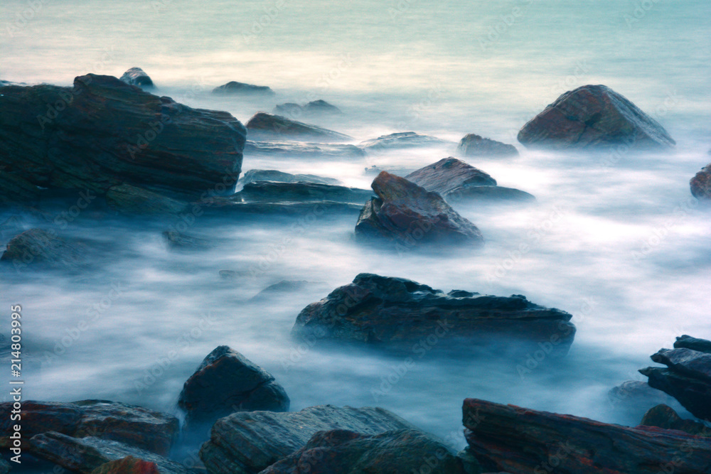 wave impact the stone, the sea, dreamy color