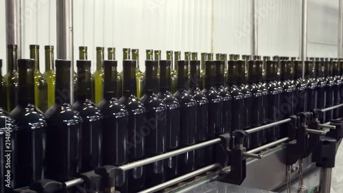 Bottling and sealing conveyor line at winery factory