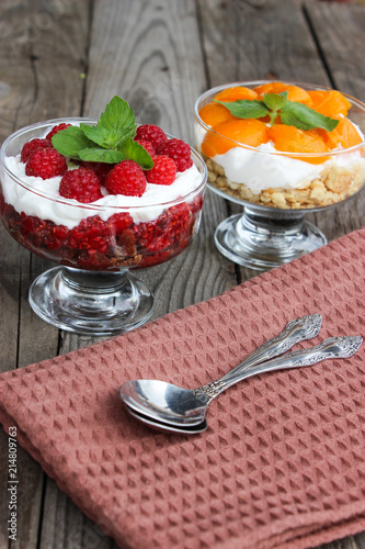 Dessert cups of Pecheneg, cottage cheese, raspberry, and apricot photo