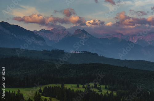 Mountain peaks lit by the rising sun. Tatra Mountains , Poland