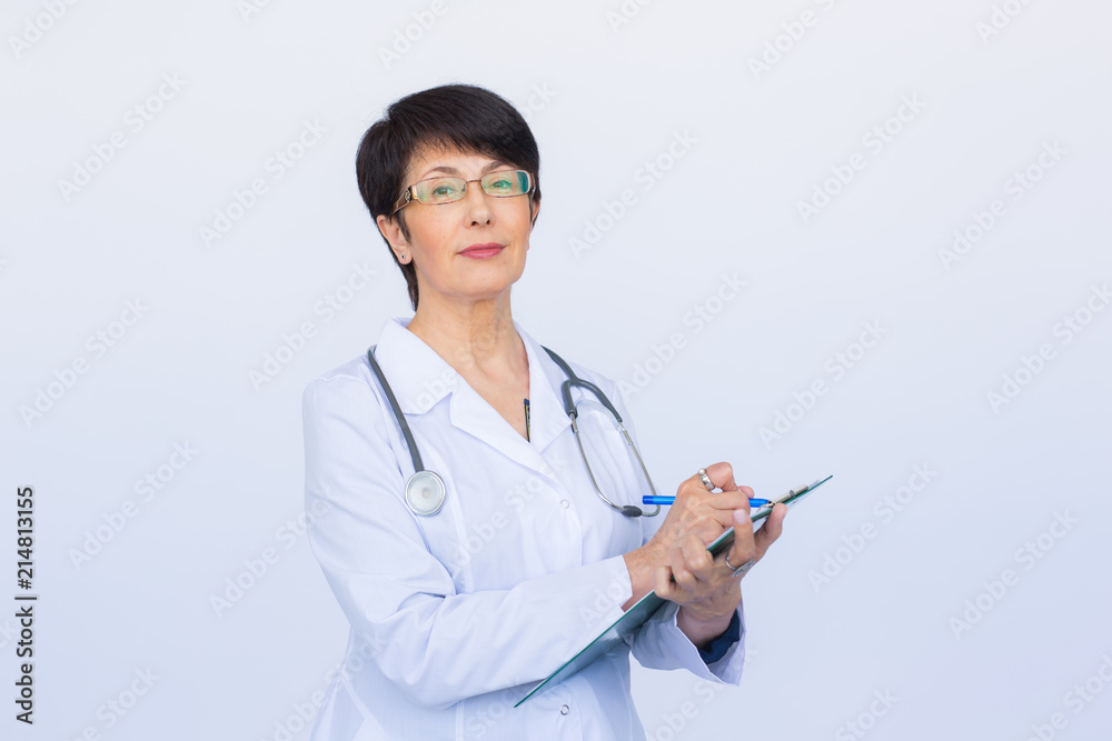 Medical doctor writing prescription over white background. Medical doctor writing prescription over white background.