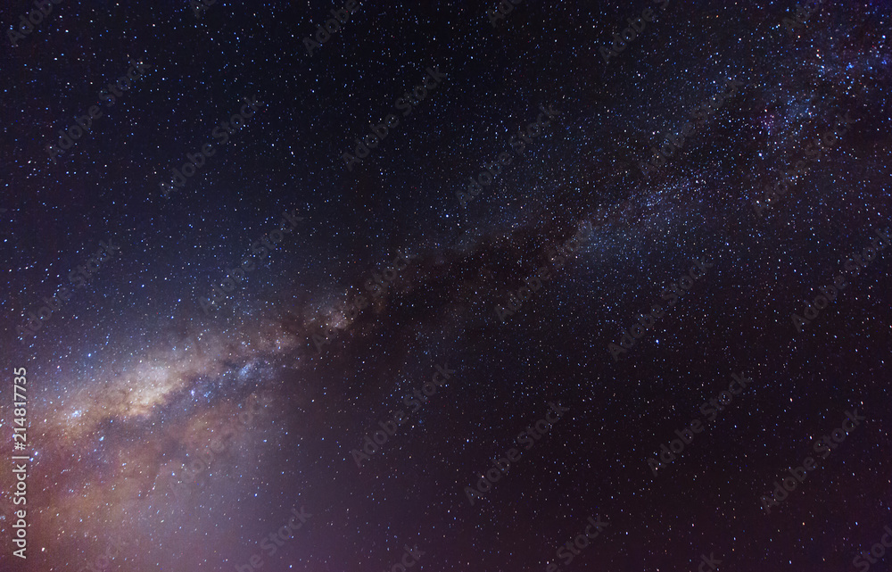 Fototapeta premium Starry night sky with stars and Milky Way Galaxy. soft focus and noise due to long expose and high iso.