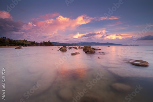 beautiful sunset seascape with vibrant sky. long expose effect.