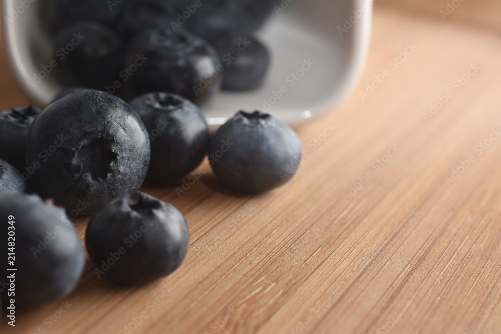 Freshly blueberries in a white ceramic bowl Freshly blueberries in a white ceramic bowl