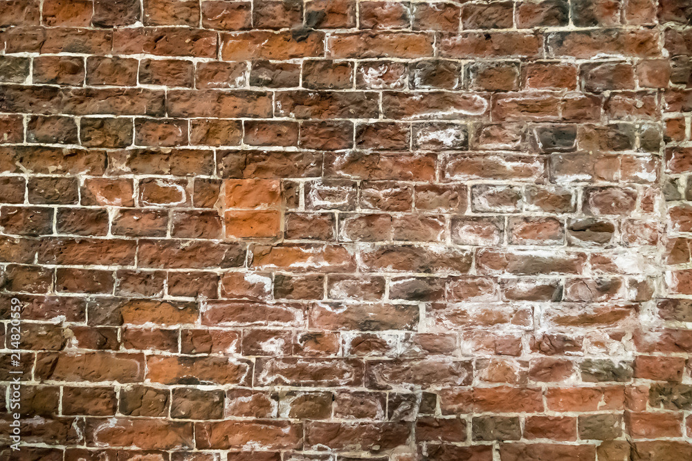 Obraz premium Old and damaged brown brick wall