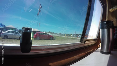 Time lapse of people walking at a music festival through a window, at Bonnaroo. photo