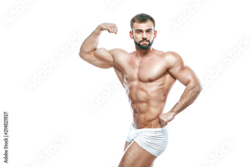 bodybuilder posing. Beautiful sporty guy male power. Fitness muscled manin white lingerie. on isolated white background.