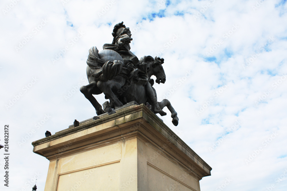 Paris / France - February 10 2013. King Louis XIV on horse sculpture in Paris. Building Louvre museum. French architecture. 	